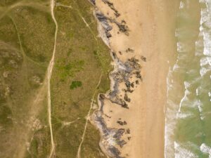 Drone view of the shore of the ocean near Newquay Beach, Cornwall